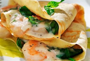 Crepes con gamberetti e spinaci